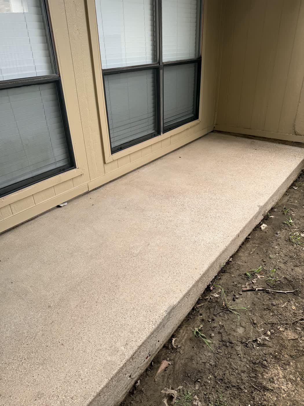 Clean restored concrete walkway after pressure washing
