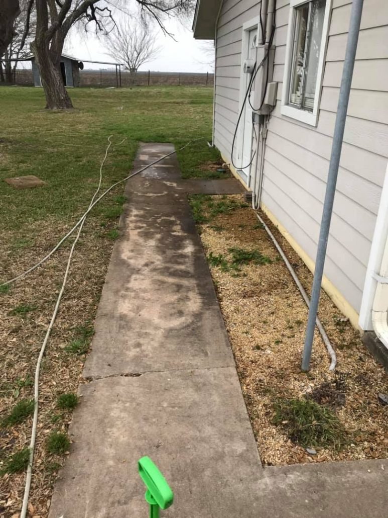 Dirty stained walkway before pressure washing